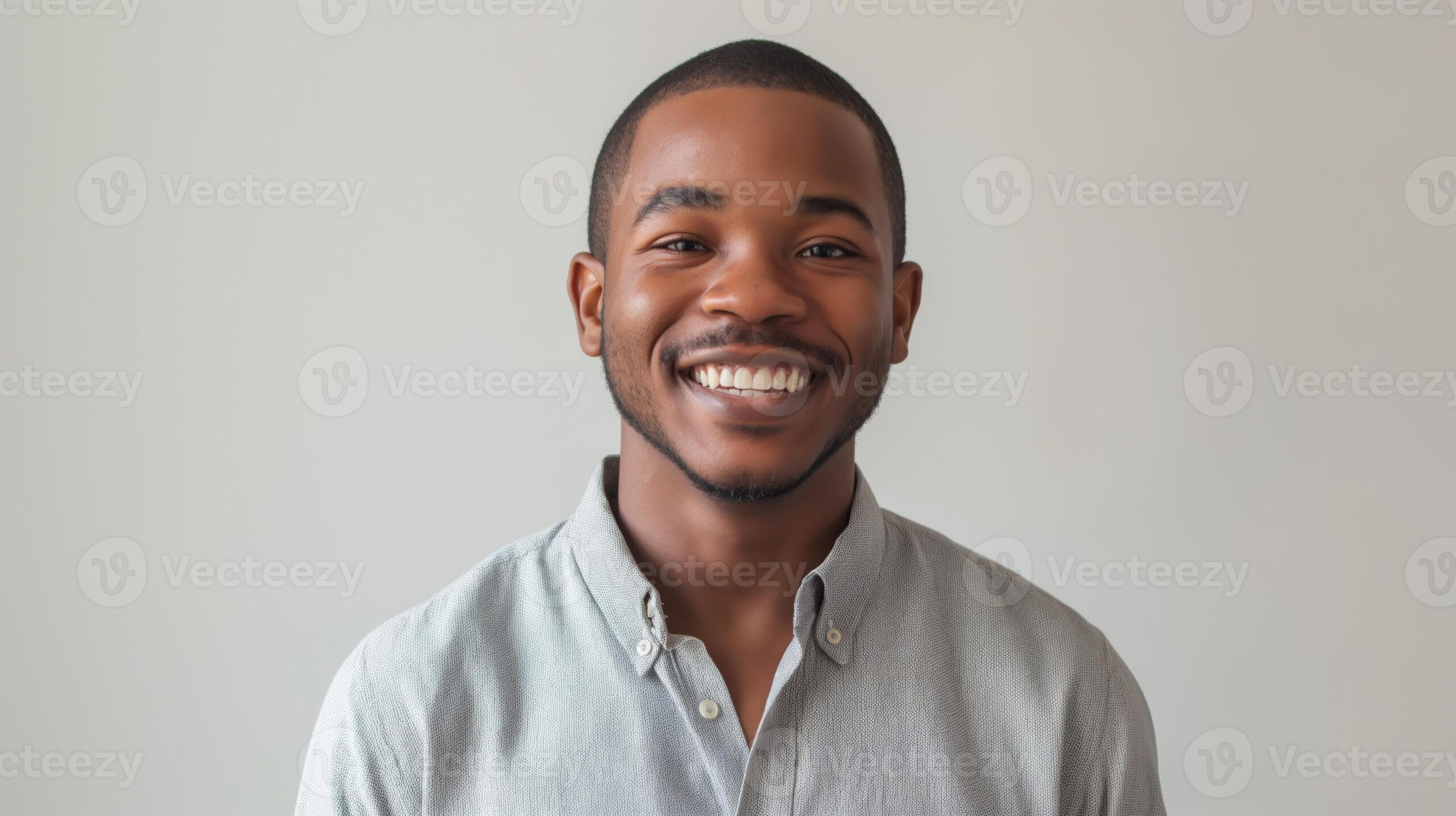 smiling african american young man in casual shirt professional portrait for business or social media use photo